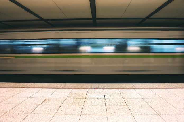 Metro train speeding up in the subway