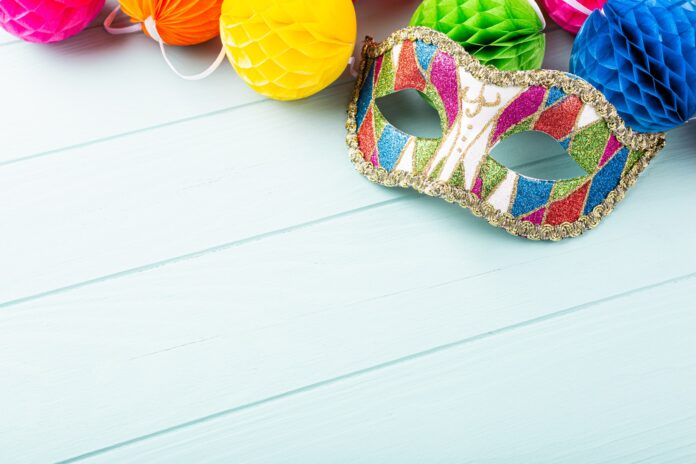 Festive background with carnival mask