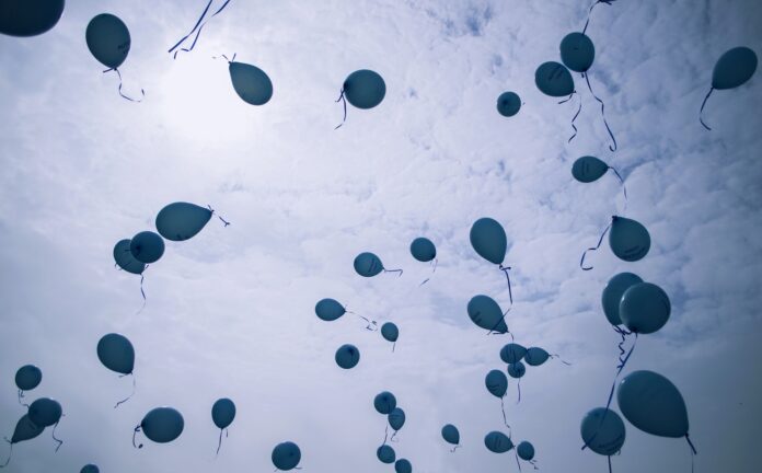 Blue balloons up in the sky