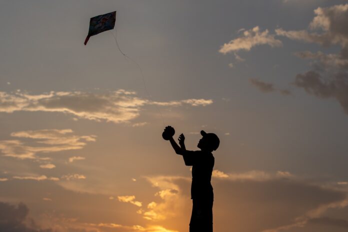 Kid flying kite